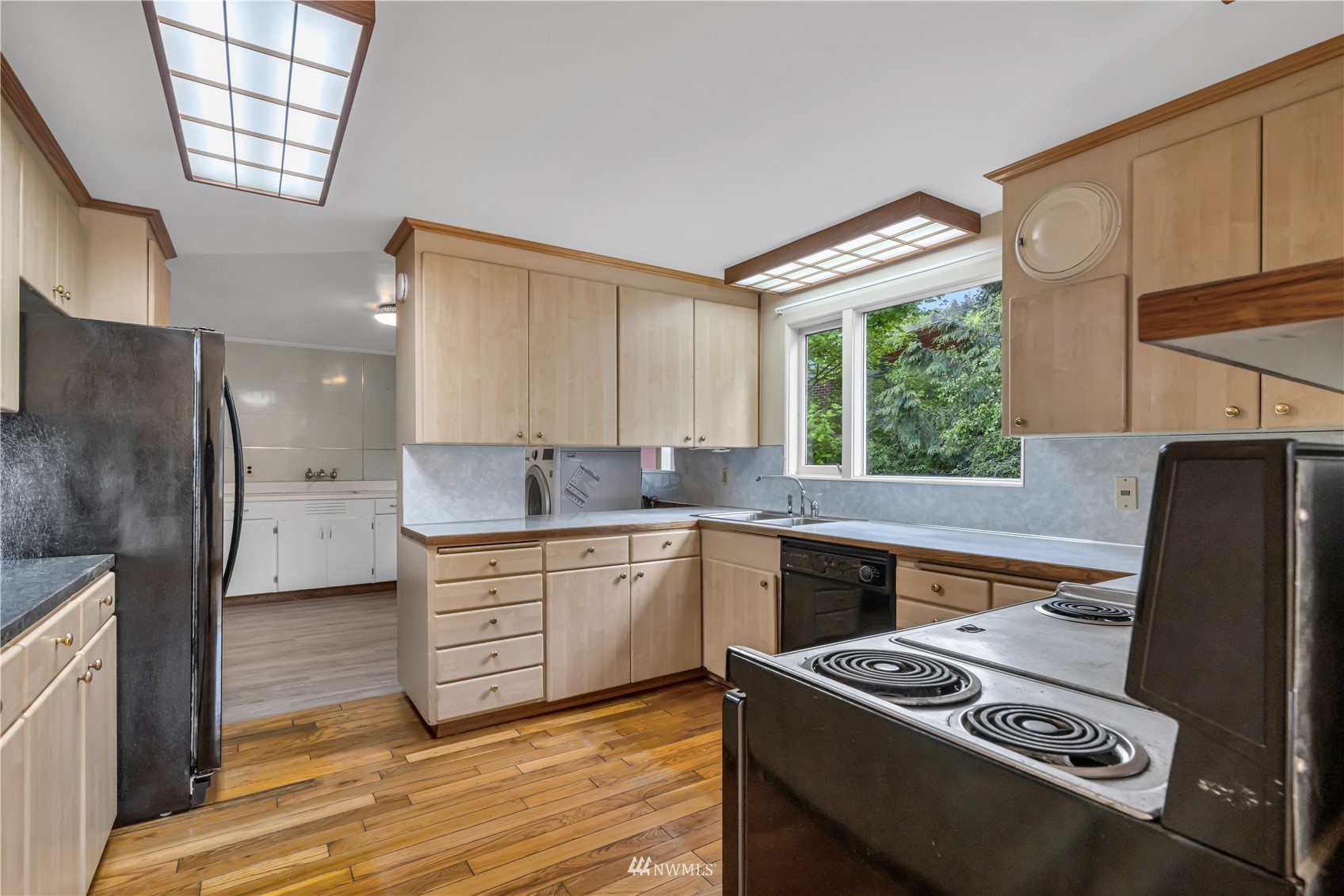 591 Pleasant Bay Road Bellingham, WA 98229 - Photo 16 of 40 a kitchen with stainless steel appliances granite countertop a stove a refrigerator and a sink