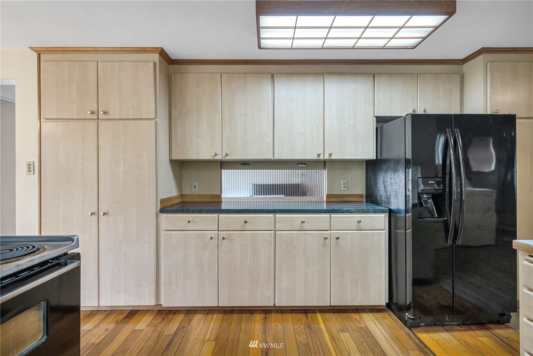 591 Pleasant Bay Road Bellingham, WA 98229 - Photo 17 of 40 a kitchen with stainless steel appliances granite countertop a refrigerator and a stove