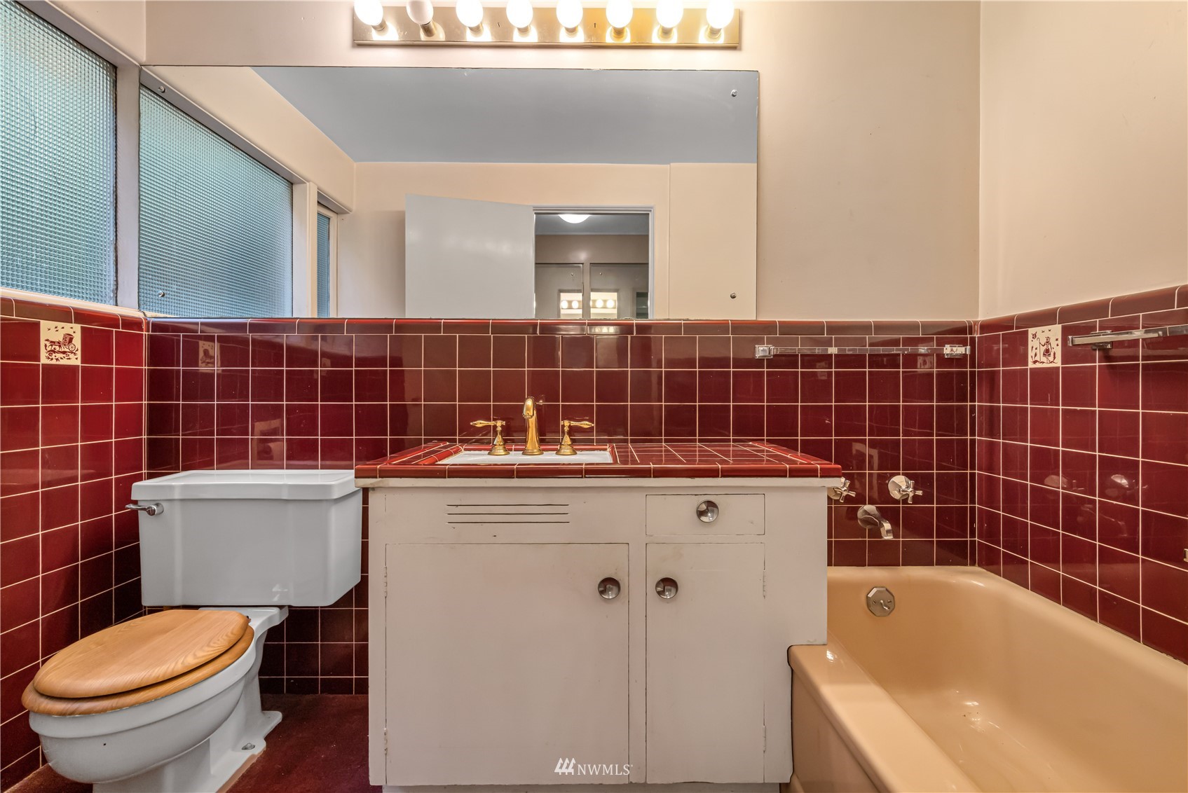 591 Pleasant Bay Road Bellingham, WA 98229 - Photo 21 of 40 a bathroom with a sink a toilet and shower