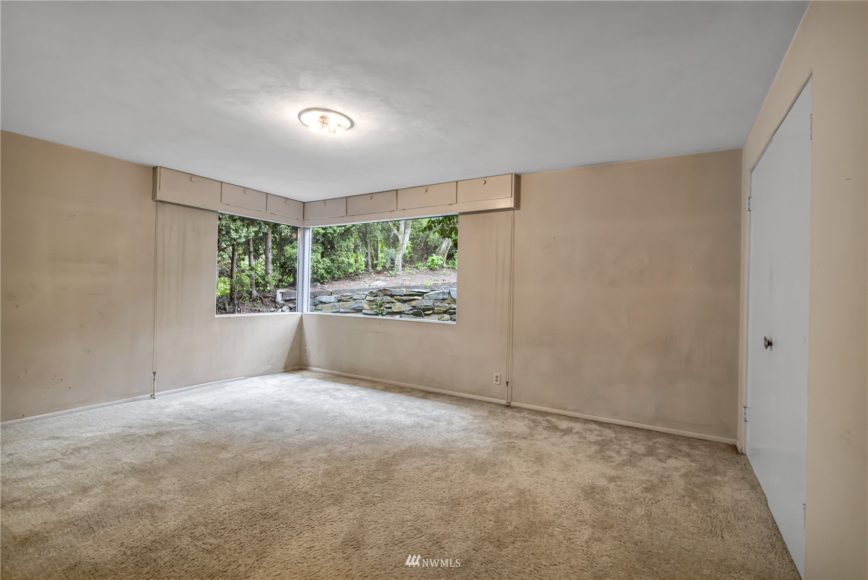 591 Pleasant Bay Road Bellingham, WA 98229 - Photo 22 of 40 a view of an empty room with a window