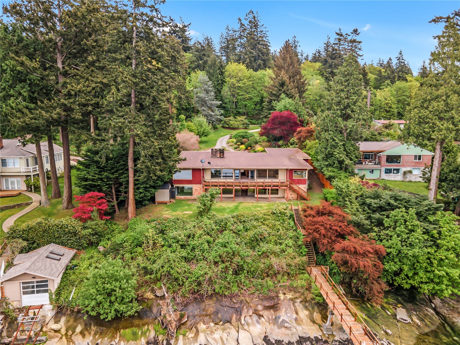 591 Pleasant Bay Road Bellingham, WA 98229 - Photo 5 of 40 a view of a house with a yard and garden
