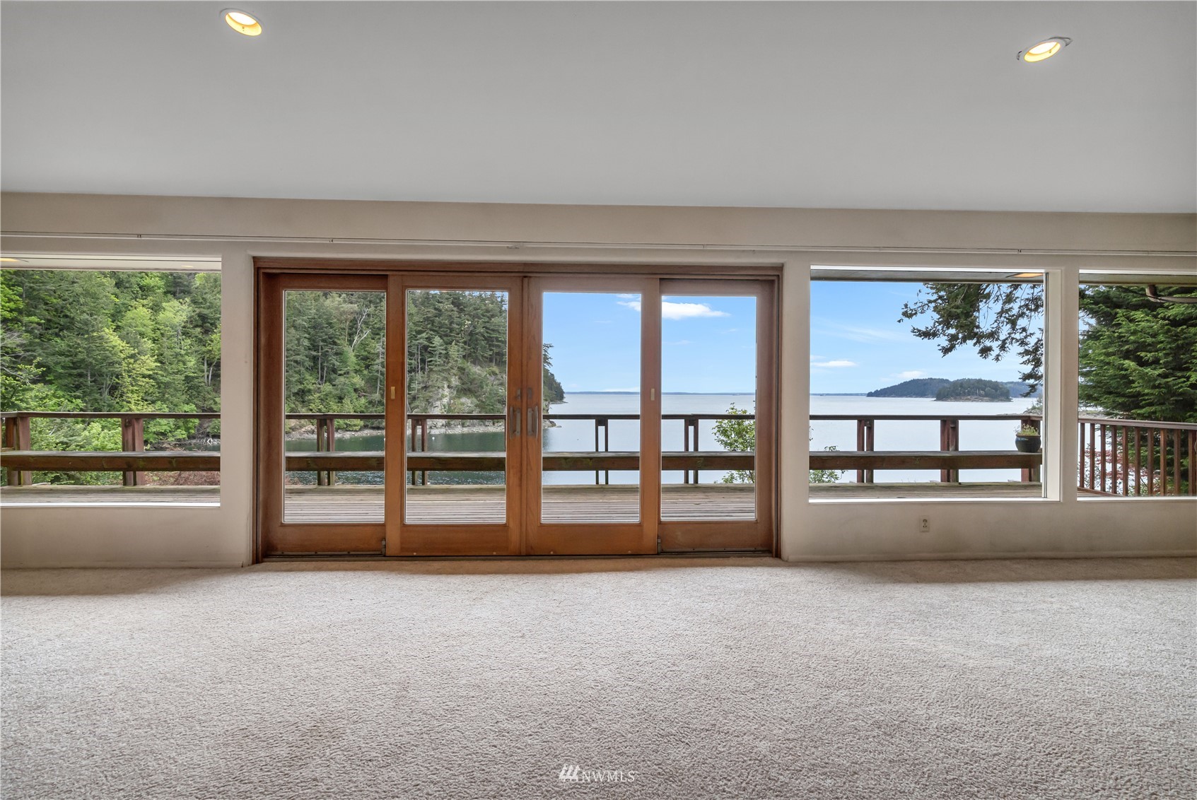 591 Pleasant Bay Road Bellingham, WA 98229 - Photo 10 of 40 wooden floor in an empty room with a window