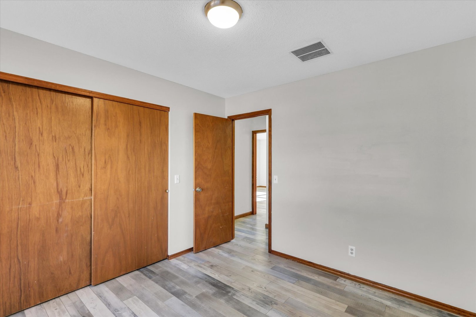 705 East Scovill Street Urbana, IL 61801 - Photo 16 of 28 a view of a room with wooden floor and bathroom