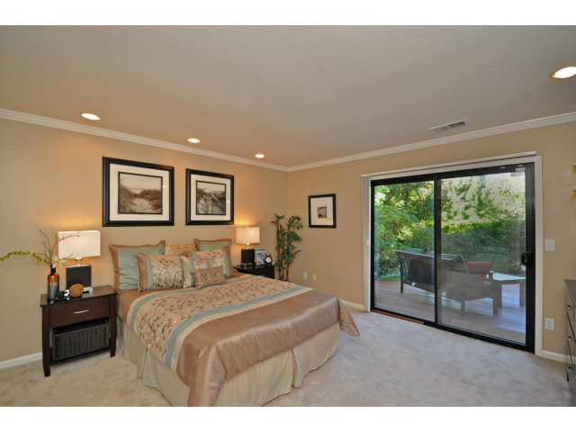 1691 Grant Road Mountain View, CA 94040 - Photo 12 of 25 a bedroom with a large bed and a large window