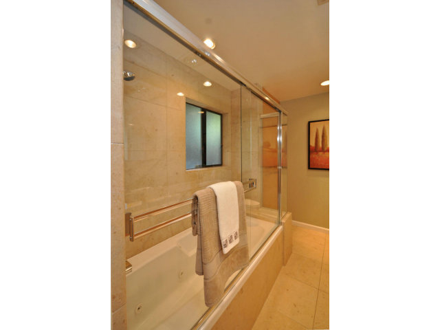 1691 Grant Road Mountain View, CA 94040 - Photo 15 of 25 a bathroom with a glass shower door