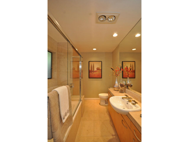 1691 Grant Road Mountain View, CA 94040 - Photo 17 of 25 a bathroom with a sink a toilet and a mirror