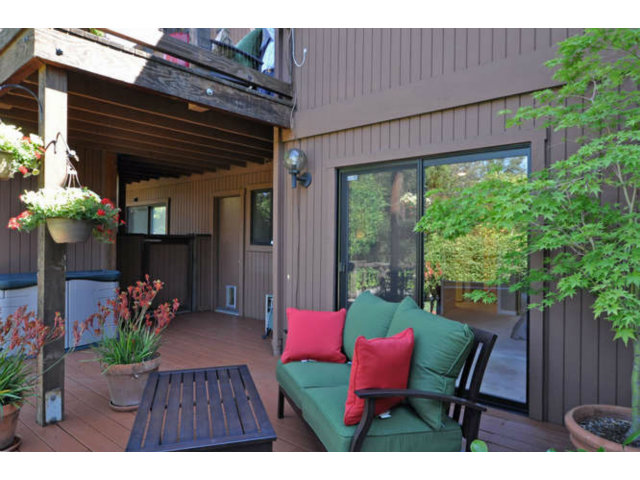 1691 Grant Road Mountain View, CA 94040 - Photo 23 of 25 a wooden bench sitting in front of a building
