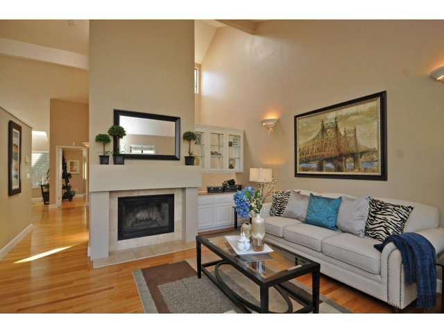 1691 Grant Road Mountain View, CA 94040 - Photo 3 of 25 a living room with furniture and a fireplace