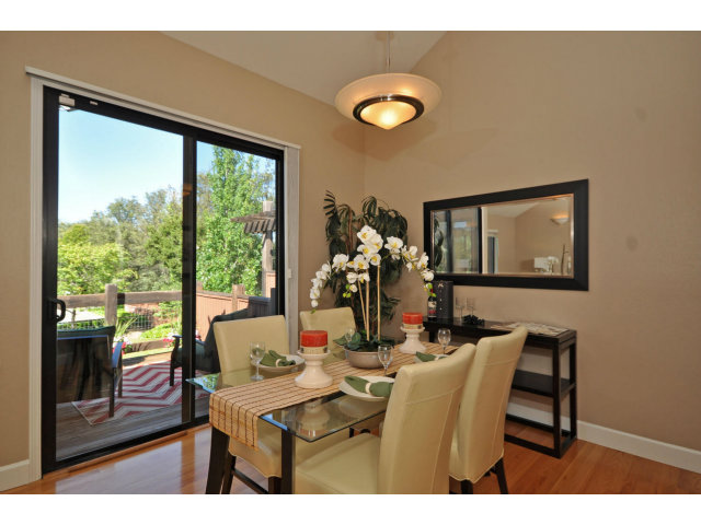 1691 Grant Road Mountain View, CA 94040 - Photo 6 of 25 a dining room with furniture and a large window
