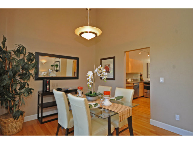 1691 Grant Road Mountain View, CA 94040 - Photo 7 of 25 a view of a dining room with furniture and wooden floor