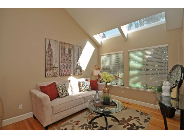1691 Grant Road Mountain View, CA 94040 - Photo 8 of 25 a living room with furniture and floor to ceiling windows