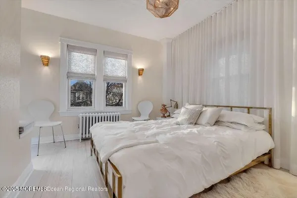a bedroom with double bed and a window