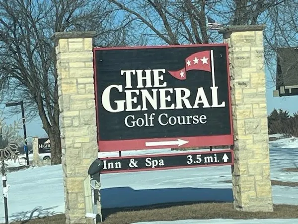 a view of a chairs and table in the patio