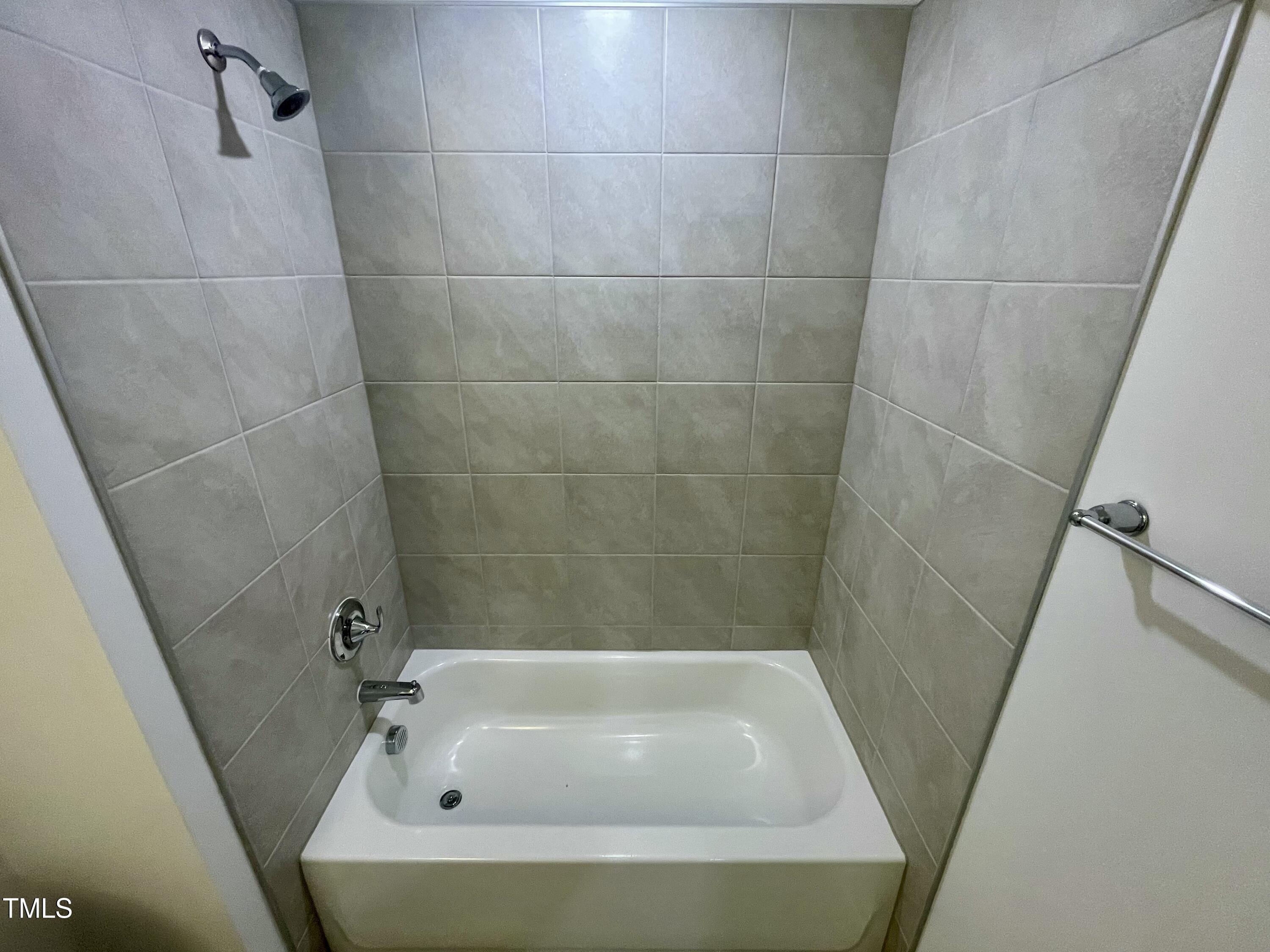 2109 Lambert Road, Unit 65 Cary, NC 27519 - Photo 43 of 87 33. upper level hall bath tub with tile