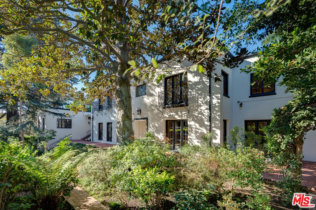 2529 North Commonwealth Avenue Los Angeles, CA 90027 - Photo 3 of 45 a front view of a house with a tree in a yard