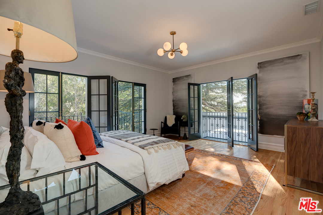 2529 North Commonwealth Avenue Los Angeles, CA 90027 - Photo 22 of 45 a bedroom with a bed and a large window