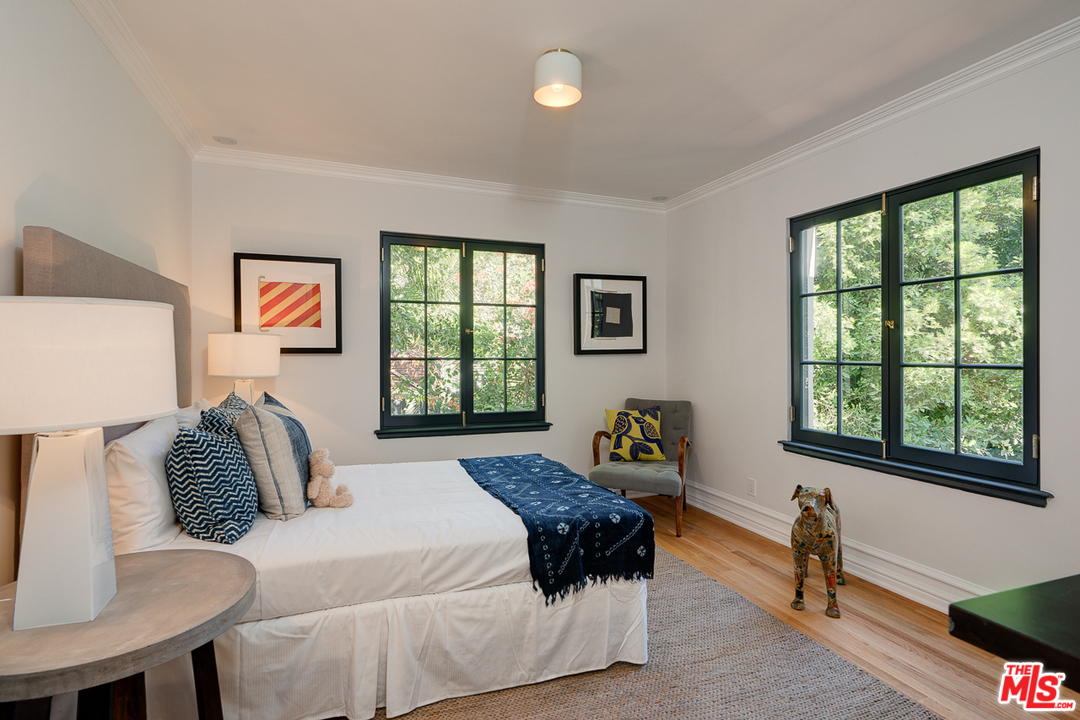 2529 North Commonwealth Avenue Los Angeles, CA 90027 - Photo 27 of 45 a bedroom with a bed and a window