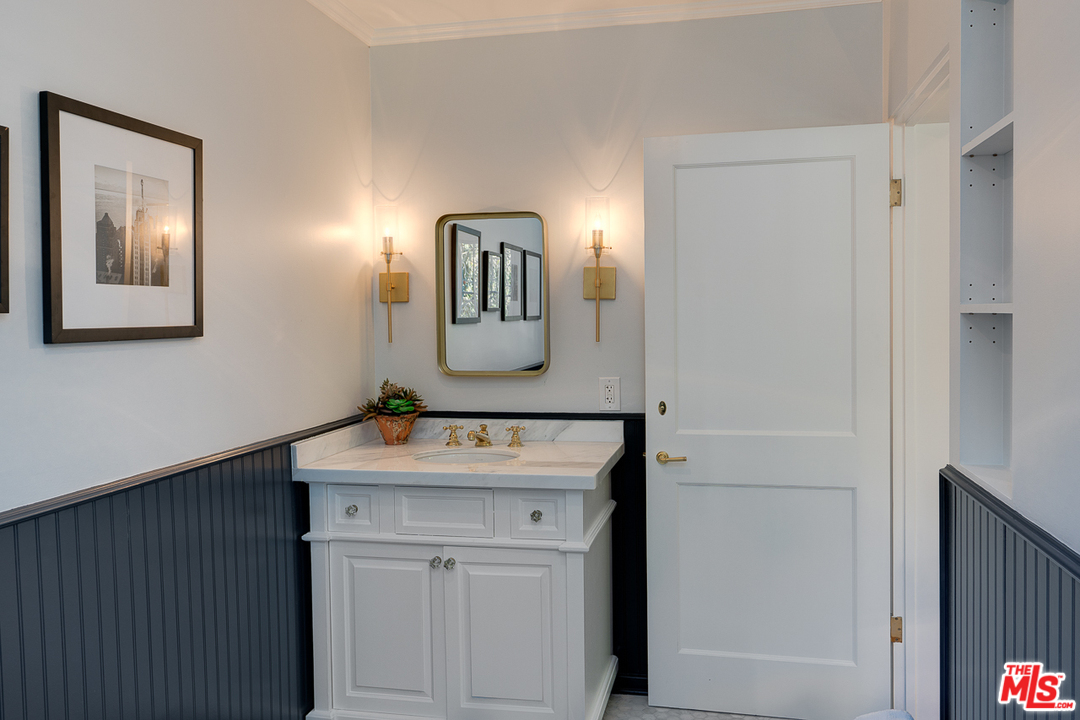 2529 North Commonwealth Avenue Los Angeles, CA 90027 - Photo 32 of 45 a bathroom with a sink and a mirror