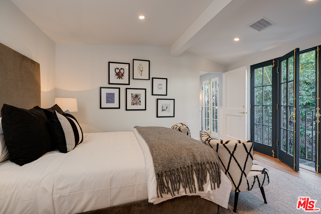 2529 North Commonwealth Avenue Los Angeles, CA 90027 - Photo 33 of 45 a bedroom with double bed and a large window