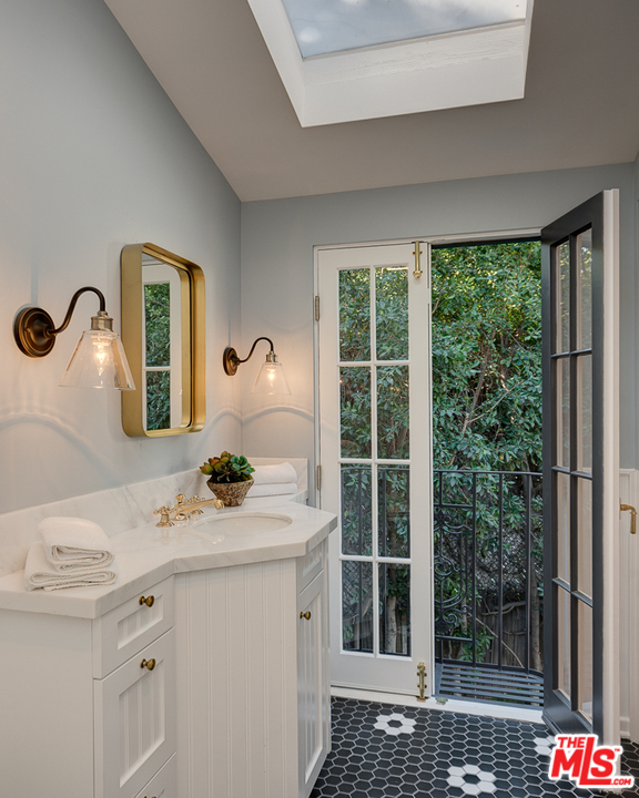 2529 North Commonwealth Avenue Los Angeles, CA 90027 - Photo 35 of 45 a bathroom with a sink a toilet and shower