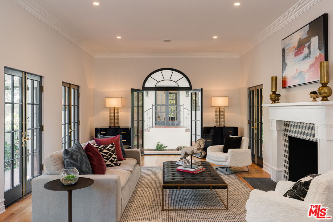 2529 North Commonwealth Avenue Los Angeles, CA 90027 - Photo 6 of 45 a living room with furniture fireplace and large windows