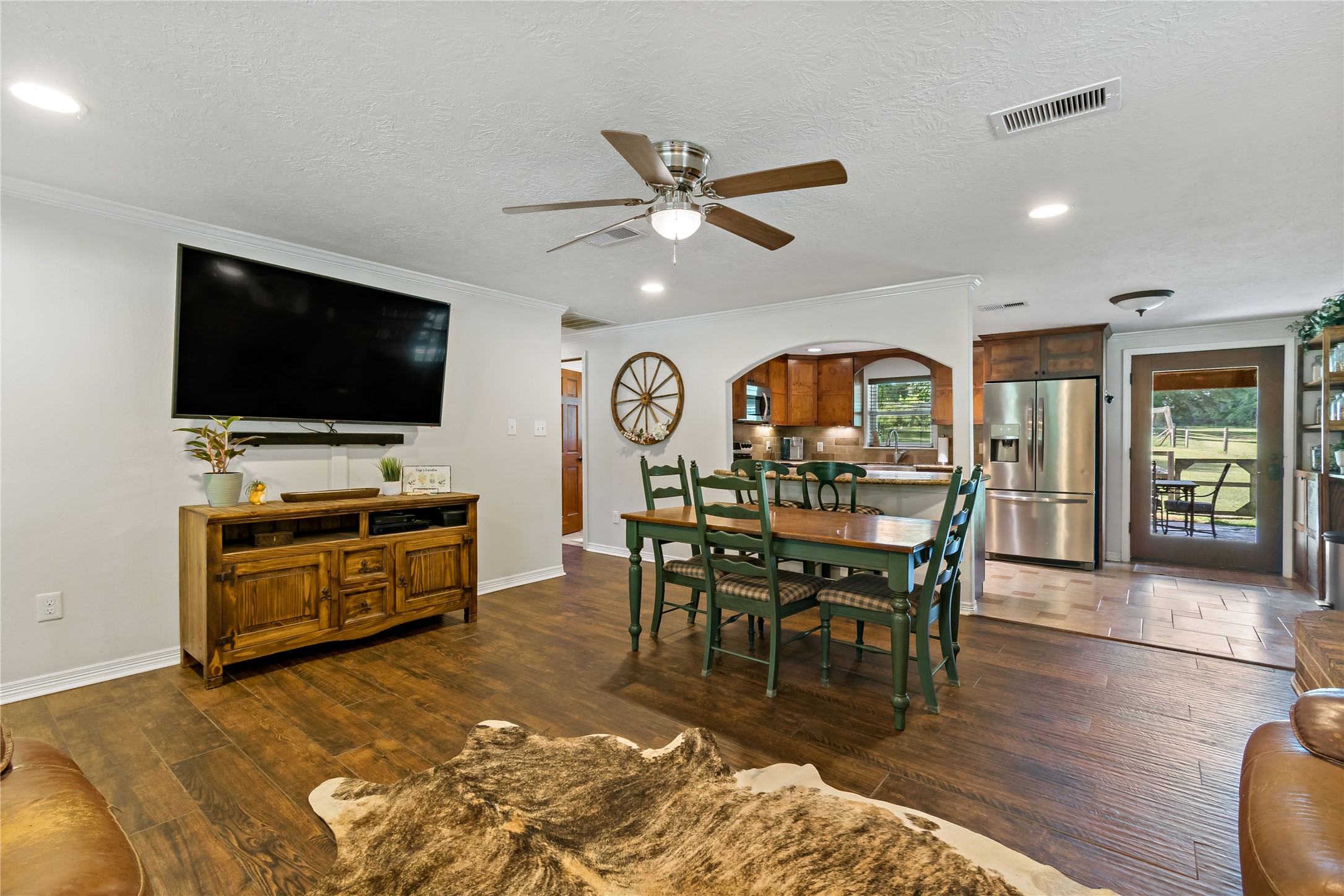 891 Lower Vann Road Coldspring, TX 77331 - Photo 16 of 23 a living room with furniture and a flat screen tv