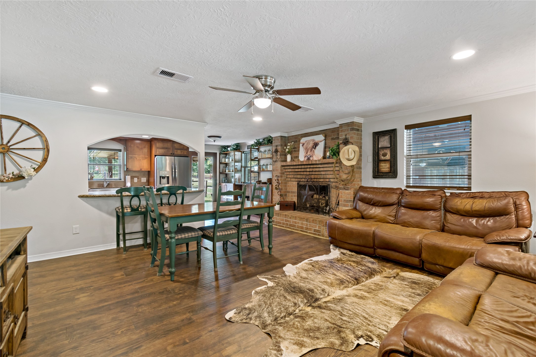 891 Lower Vann Road Coldspring, TX 77331 - Photo 17 of 23 a living room with furniture and a fireplace