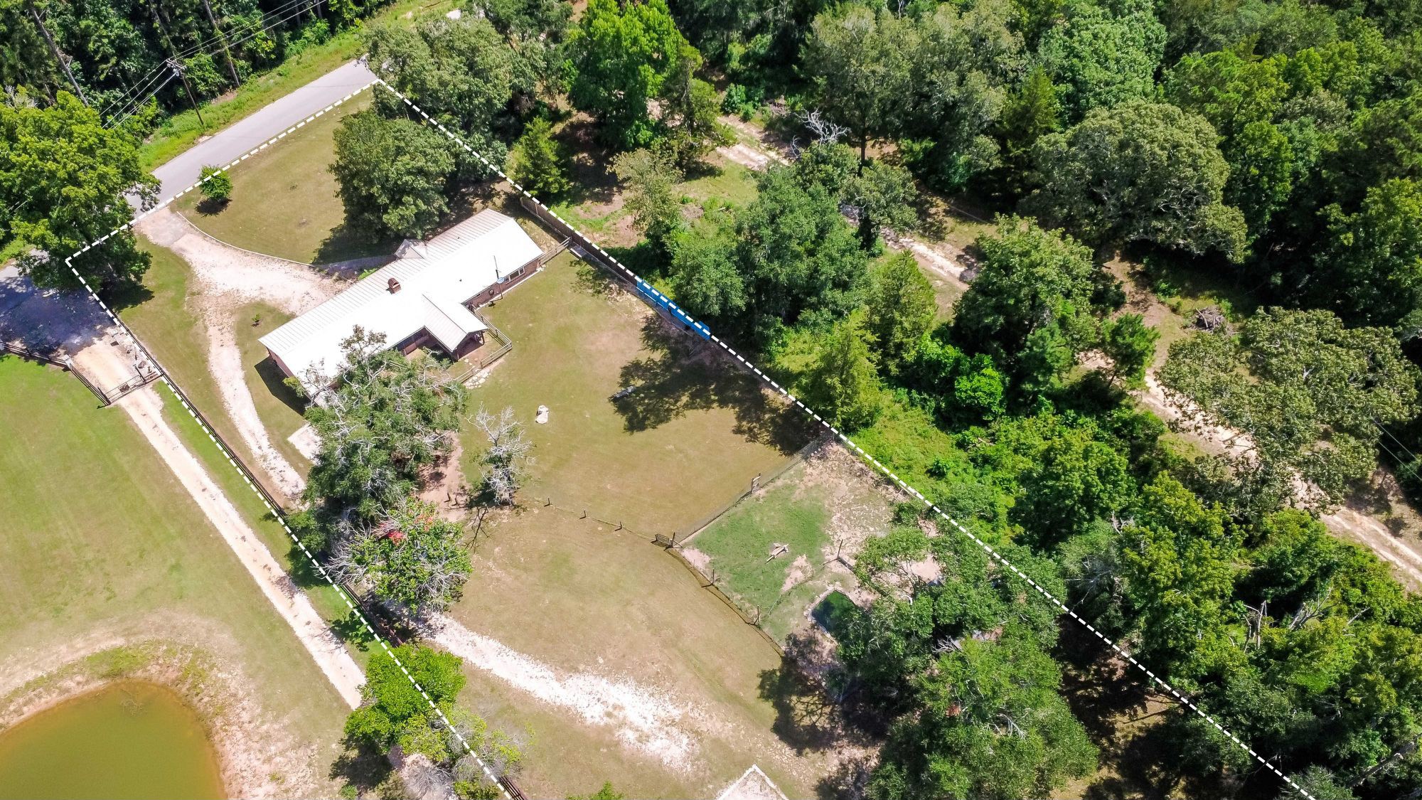 891 Lower Vann Road Coldspring, TX 77331 - Photo 2 of 23 an aerial view of a house