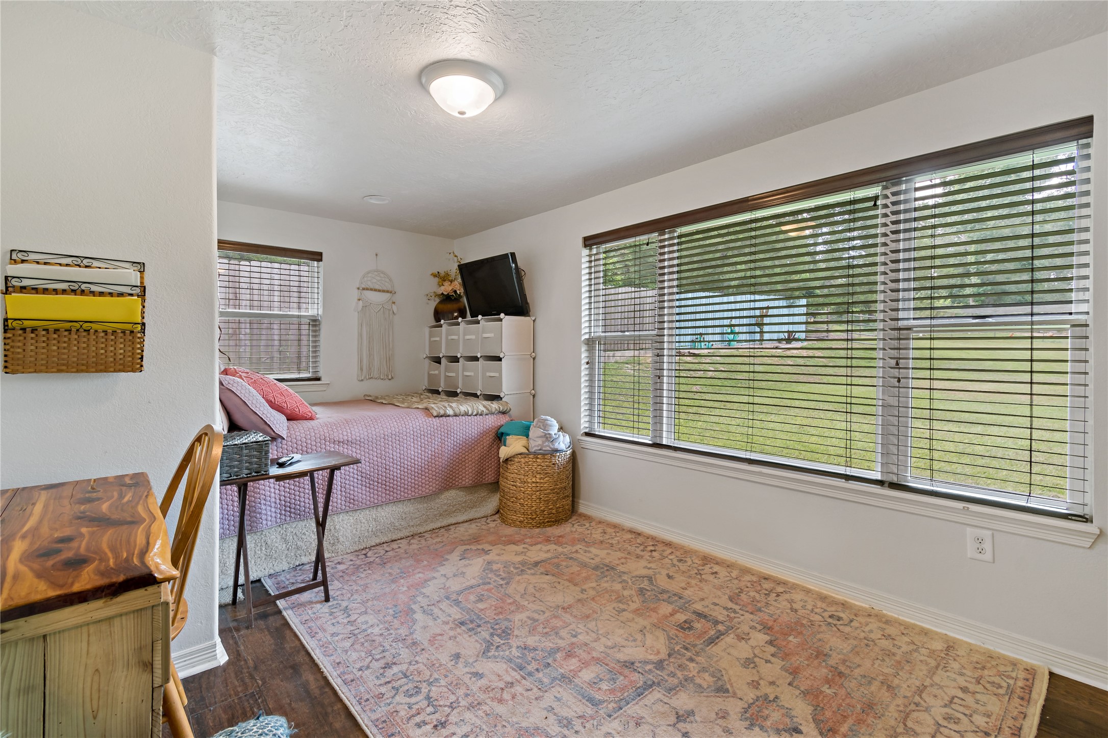 891 Lower Vann Road Coldspring, TX 77331 - Photo 23 of 23 a bedroom with furniture and a window