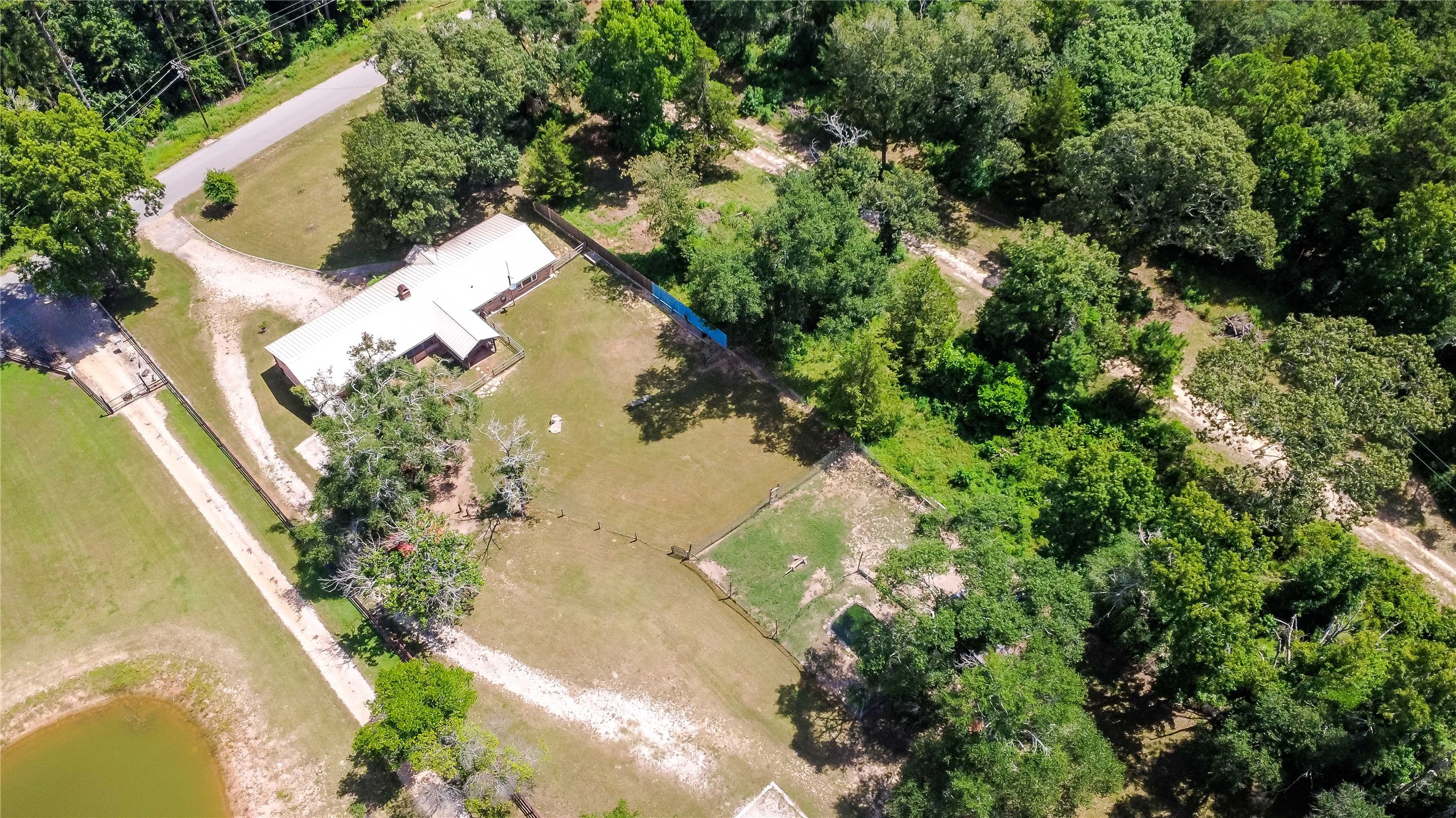 891 Lower Vann Road Coldspring, TX 77331 - Photo 6 of 23 an aerial view of a house with yard