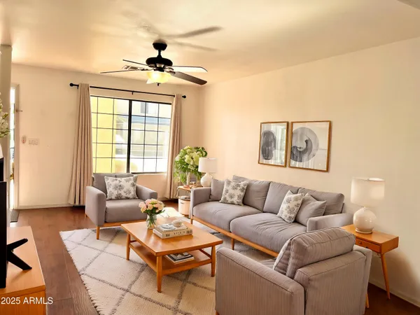 a living room with furniture and a large window