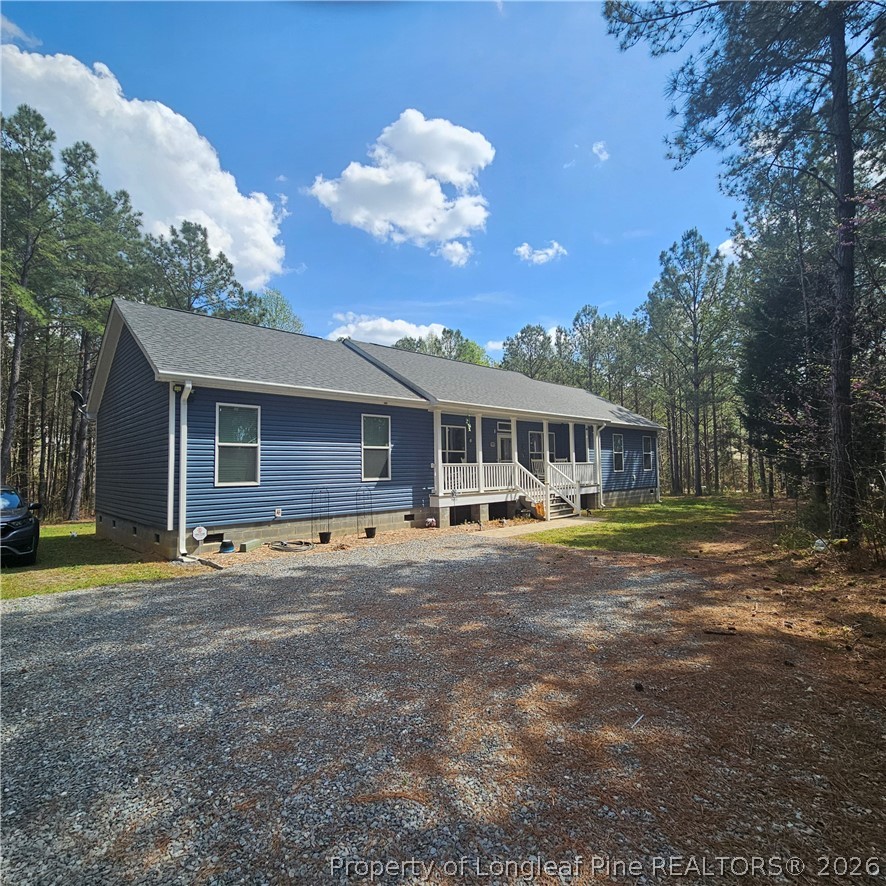 951 Lucian Hilliard Road Goldston, NC 27252 - Photo 3 of 25 a view of a house with backyard and sitting area