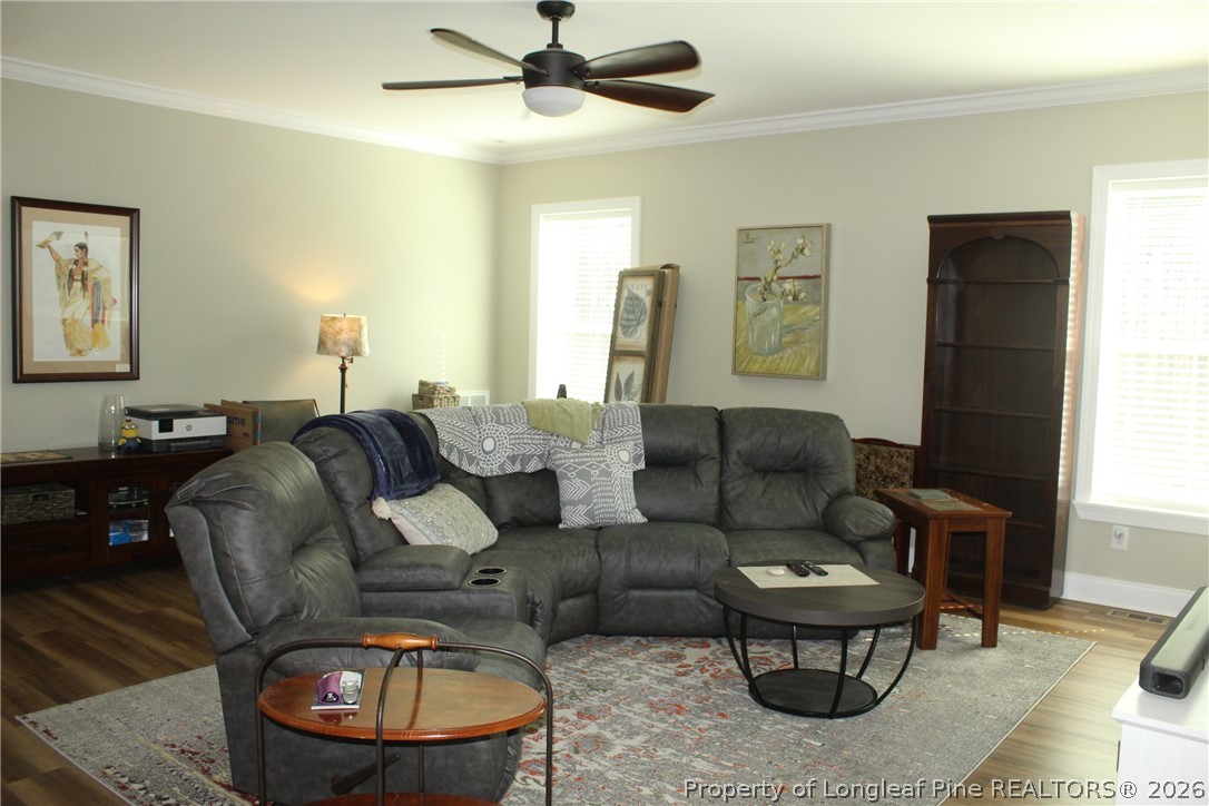 951 Lucian Hilliard Road Goldston, NC 27252 - Photo 4 of 25 a living room with furniture and a window