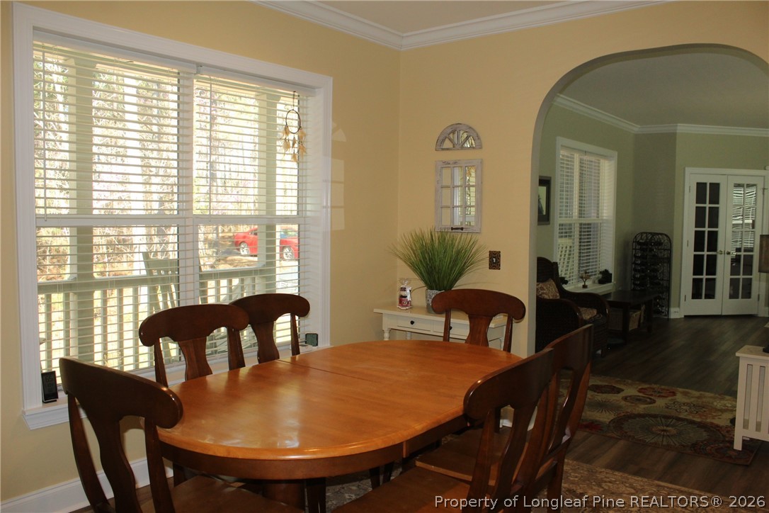 951 Lucian Hilliard Road Goldston, NC 27252 - Photo 8 of 25 a view of a dining room with furniture and wooden floor