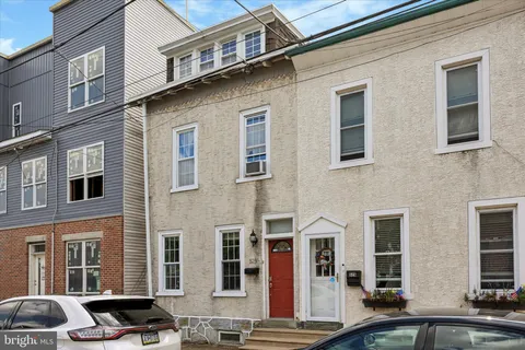 a front view of a building with many windows
