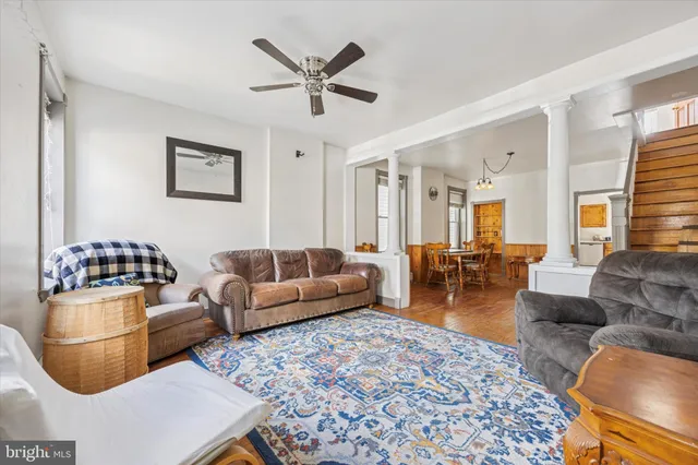 a living room with furniture and a rug