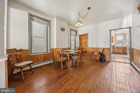 a view of a livingroom with furniture and wooden floor