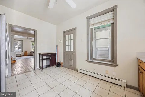 a view of a room window and wooden floor