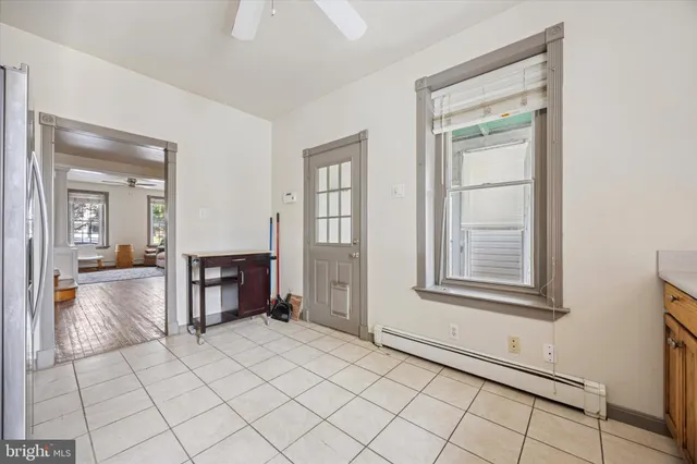 a view of a room window and wooden floor