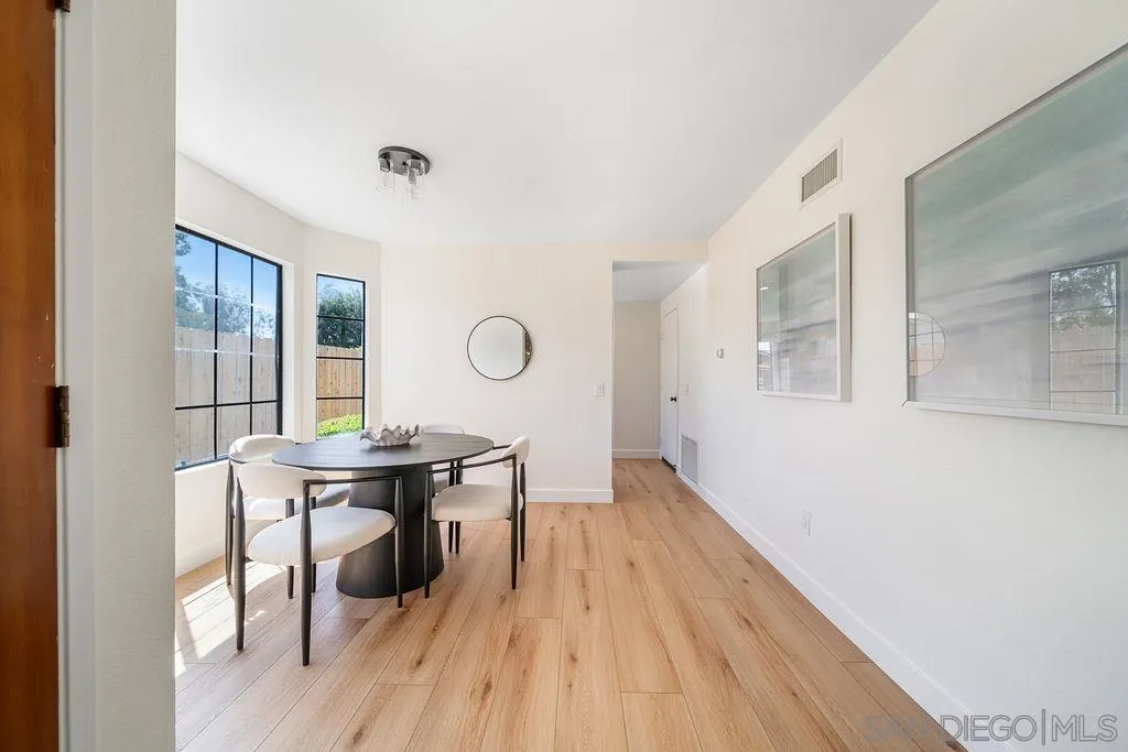 13489 Ridley Road San Diego, CA 92129 - Photo 17 of 36 a view of a workspace room with wooden floor and furniture