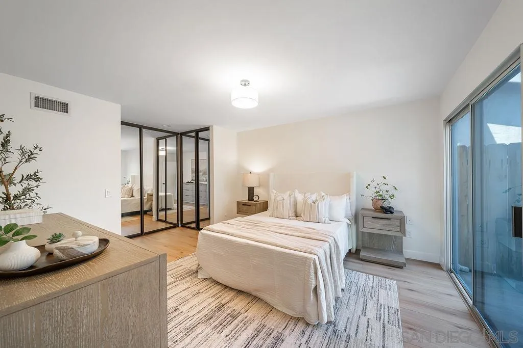 13489 Ridley Road San Diego, CA 92129 - Photo 24 of 36 a bedroom with a bed and a couch