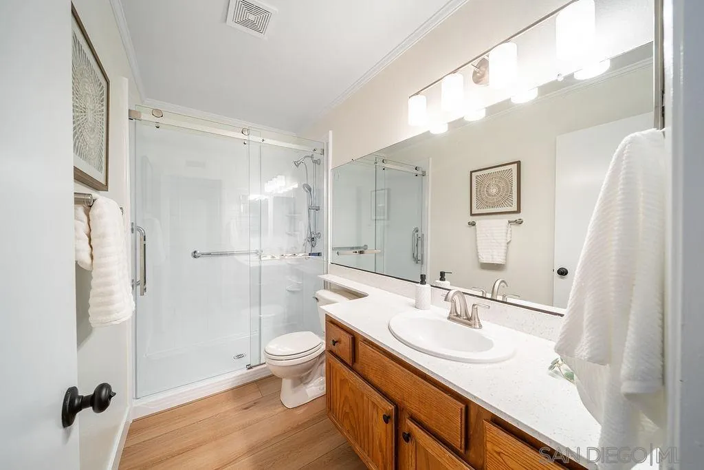13489 Ridley Road San Diego, CA 92129 - Photo 27 of 36 a bathroom with a sink a toilet and shower