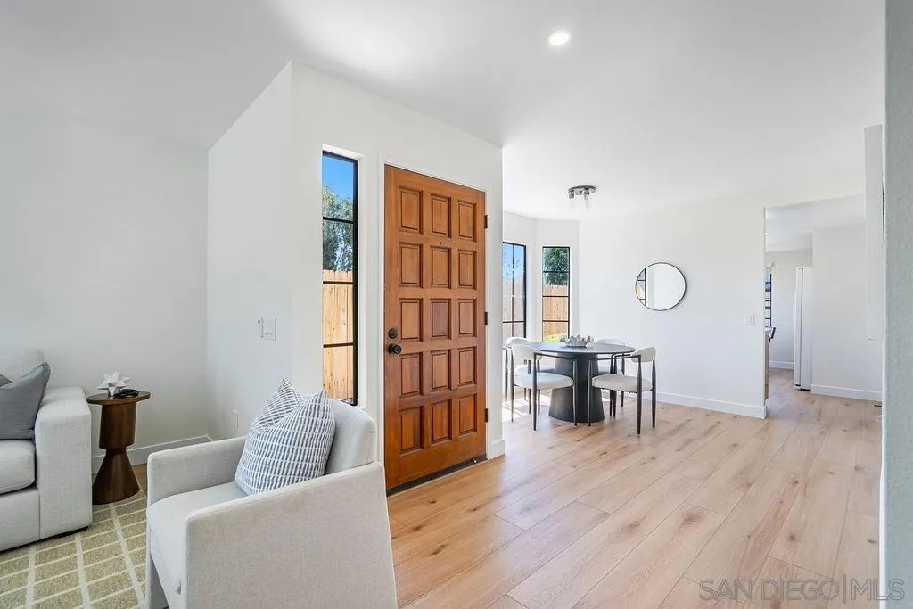 13489 Ridley Road San Diego, CA 92129 - Photo 10 of 36 a living room with furniture wooden floor and a table