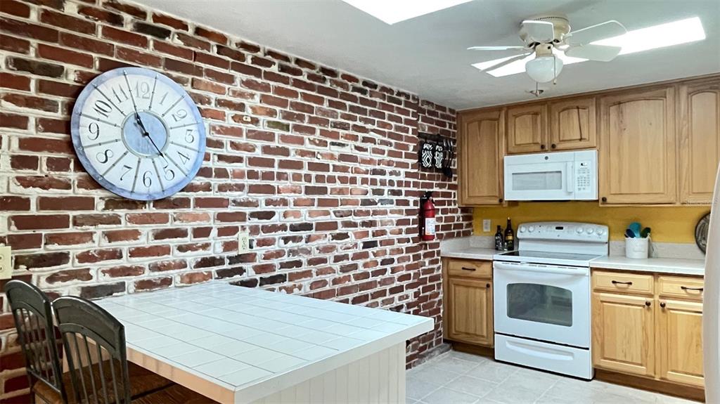 2233 Alice Road Sarasota, FL 34231 - Photo 11 of 30 a kitchen with a cabinets and stove
