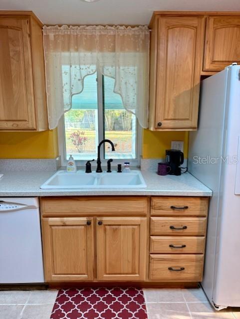 2233 Alice Road Sarasota, FL 34231 - Photo 14 of 30 a kitchen with stainless steel appliances a counter space and a window