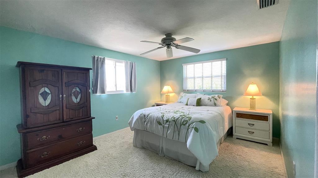 2233 Alice Road Sarasota, FL 34231 - Photo 15 of 30 a bedroom with a bed and a dresser