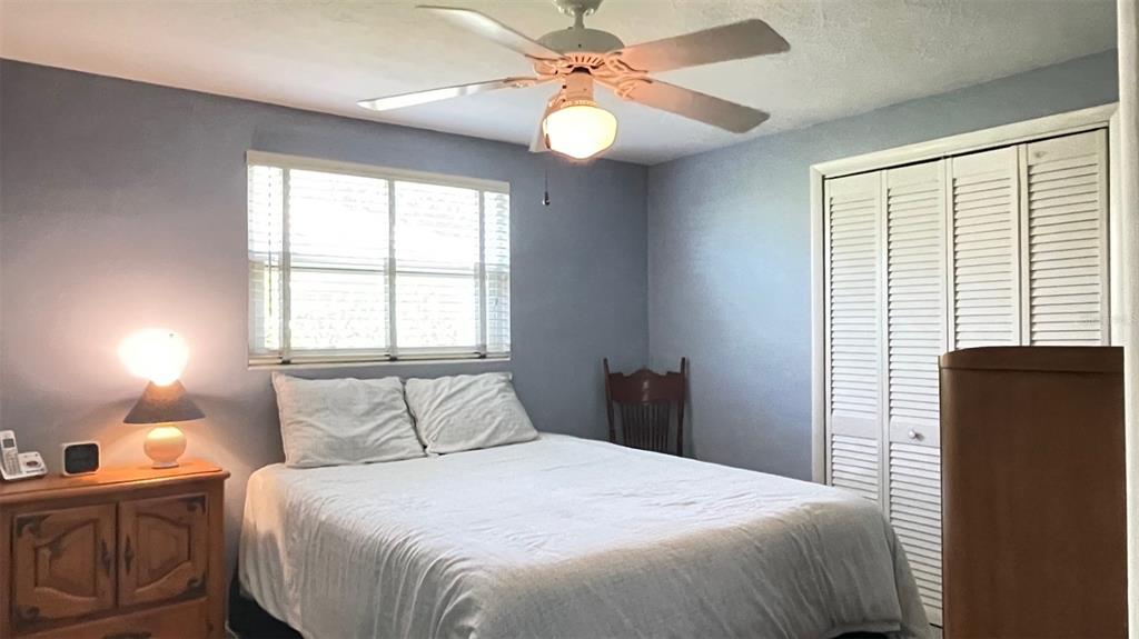 2233 Alice Road Sarasota, FL 34231 - Photo 16 of 30 a bedroom with a bed and a window