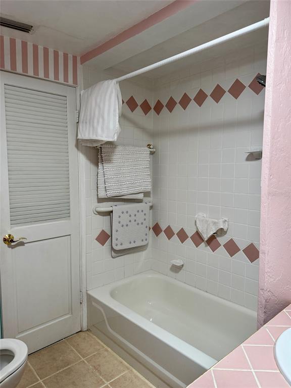 2233 Alice Road Sarasota, FL 34231 - Photo 19 of 30 a bathroom with a bathtub and a shower