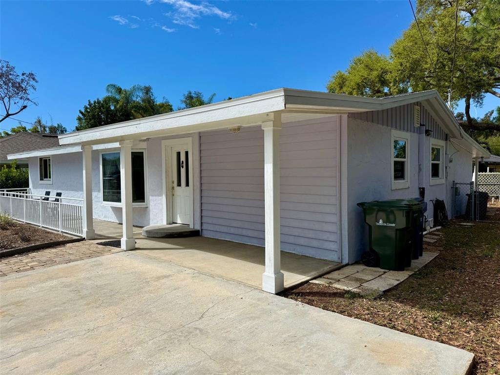 2233 Alice Road Sarasota, FL 34231 - Photo 2 of 30 a backyard of a house with seating space