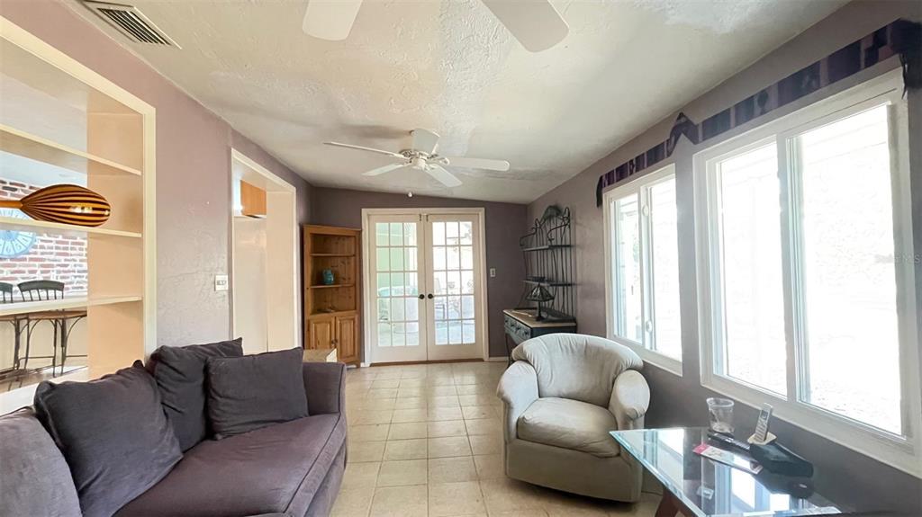 2233 Alice Road Sarasota, FL 34231 - Photo 21 of 30 a living room with furniture and a large window
